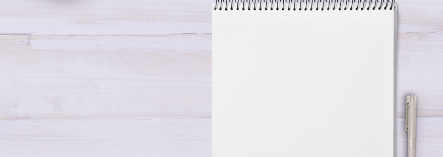 Empty notepad against a lilac background