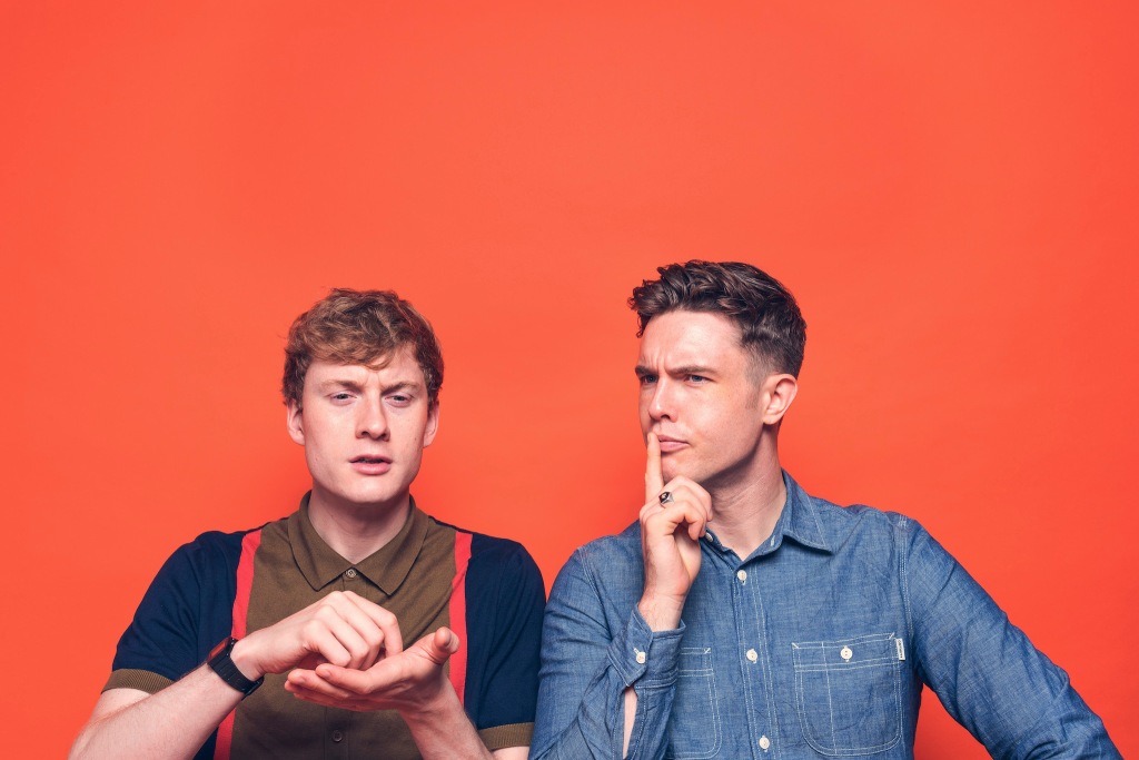 James Acaster and Ed Gamble against an orange background